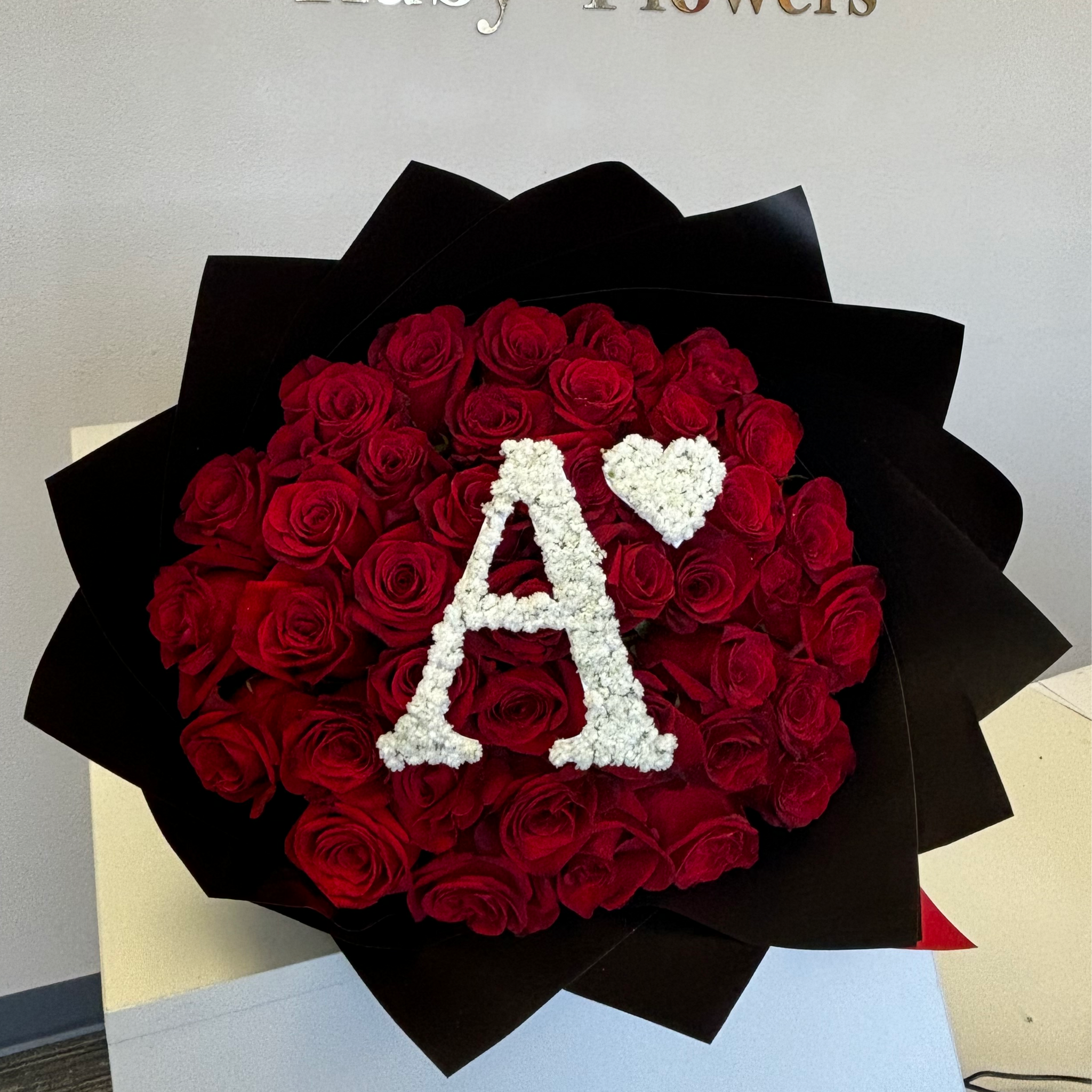 Bouquet of roses with initial letter